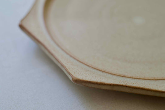 Close-up of a ceramic plate on a white surface
